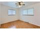Bedroom features hardwood floors, a ceiling fan, and a window for natural light at 7995 Robin Ln, Denver, CO 80221