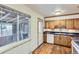 Charming kitchen featuring wood cabinets and natural light at 7995 Robin Ln, Denver, CO 80221
