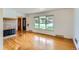 Bright living room featuring hardwood floors and a fireplace at 7995 Robin Ln, Denver, CO 80221