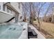 Backyard featuring a hot tub, patio with seating, and a well-maintained lawn at 5689 S Youngfield Way, Littleton, CO 80127