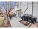 Backyard patio with outdoor seating, grill, and a covered hot tub at 5689 S Youngfield Way, Littleton, CO 80127