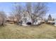 Spacious backyard features a patio, lush lawn and privacy fence, ideal for outdoor entertaining at 5689 S Youngfield Way, Littleton, CO 80127