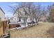 Backyard featuring a hot tub, patio with seating, grill, and a spacious lawn at 5689 S Youngfield Way, Littleton, CO 80127