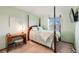 Charming bedroom with a four-poster bed and a desk near the window at 5689 S Youngfield Way, Littleton, CO 80127