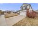 Quaint two-story home with a two-car garage, situated on a well-maintained lawn in a serene neighborhood at 5689 S Youngfield Way, Littleton, CO 80127