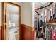 Hallway and walk-in closet with shelves and rods for storing clothes and accessories at 5689 S Youngfield Way, Littleton, CO 80127