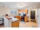 Inviting kitchen featuring oak cabinetry, granite countertops, and modern appliances at 5689 S Youngfield Way, Littleton, CO 80127