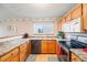 Bright kitchen with stainless steel appliances and granite countertops at 5689 S Youngfield Way, Littleton, CO 80127