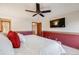 Spacious main bedroom featuring a ceiling fan and a wall-mounted television at 5689 S Youngfield Way, Littleton, CO 80127