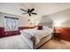 The main bedroom features an accent wall and neutral color palette at 5689 S Youngfield Way, Littleton, CO 80127