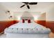 The main bedroom features an accent wall and neutral color palette at 5689 S Youngfield Way, Littleton, CO 80127