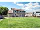 Well-maintained backyard with green lawn, ideal for relaxation and outdoor entertaining at 4863 Quail Ct, Frederick, CO 80504