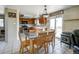 Eat-in kitchen featuring a modern oven, bright lighting, and sliding glass doors to the yard at 4863 Quail Ct, Frederick, CO 80504