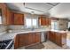 Bright kitchen with white countertops, wood cabinets, and stainless steel appliances at 4863 Quail Ct, Frederick, CO 80504