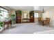 Large living room featuring neutral carpet, multiple bookshelves, and plentiful natural light at 4863 Quail Ct, Frederick, CO 80504
