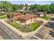 Aerial view of a well-maintained home with mature trees, landscaping, and a manicured lawn on a corner lot at 5703 Field St, Arvada, CO 80002