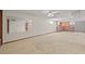 View of basement featuring carpeted flooring, and full wet bar with kitchen cabinets at 5703 Field St, Arvada, CO 80002