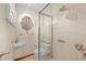 Compact updated bathroom with glass shower and unique sink design at 5703 Field St, Arvada, CO 80002