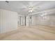 Spacious bedroom featuring mirrors and a view into the attached rooms at 5703 Field St, Arvada, CO 80002