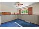 View of bedroom with blue carpet, ceiling fan and window with wood shutters at 5703 Field St, Arvada, CO 80002