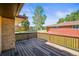 Spacious wooden deck perfect for outdoor entertaining, with brick accents at 5703 Field St, Arvada, CO 80002