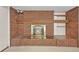 Close-up on the detailed brick fireplace featuring a wood mantel at 5703 Field St, Arvada, CO 80002