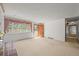 Inviting living room with large window and wooden door, seamlessly connecting to the outdoors at 5703 Field St, Arvada, CO 80002