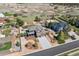 Aerial view of the home surrounded by mature trees and landscaping at 1302 Milbury St, Castle Rock, CO 80104