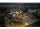 Aerial view of a beautifully landscaped home with a spacious yard and inviting curb appeal at twilight at 1302 Milbury St, Castle Rock, CO 80104