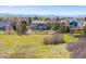 Aerial view showcasing the property, surrounding neighborhood, and mountain views at 1302 Milbury St, Castle Rock, CO 80104