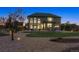 Exterior view showcasing the backyard, patio, and well-manicured lawn at 1302 Milbury St, Castle Rock, CO 80104