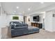 Spacious basement living room with large comfortable seating and recessed lighting at 1302 Milbury St, Castle Rock, CO 80104