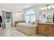 Bright primary bathroom with tile flooring, soaking tub, and dual vanities with granite countertops at 1302 Milbury St, Castle Rock, CO 80104