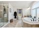 Bright primary bathroom features a separate shower, soaking tub, and window for natural light at 1302 Milbury St, Castle Rock, CO 80104
