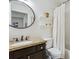 Cozy bathroom with granite vanity, modern fixtures, toilet, and shower with curtain at 1302 Milbury St, Castle Rock, CO 80104