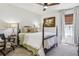 Cozy bedroom features a four-poster bed, classic decor, and a window for natural light at 1302 Milbury St, Castle Rock, CO 80104