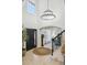 Elegant foyer with a soaring ceiling, stylish chandelier, and a glimpse into the inviting living spaces at 1302 Milbury St, Castle Rock, CO 80104
