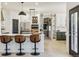 Gourmet kitchen boasts a large center island, custom cabinetry, and stainless steel appliances at 1302 Milbury St, Castle Rock, CO 80104
