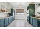 Spacious modern kitchen with custom cabinetry, high-end appliances, and a scenic view from the window at 1302 Milbury St, Castle Rock, CO 80104