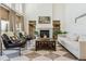 Comfortable living room with fireplace, decor shelving, bright natural light, and contemporary furnishings at 1302 Milbury St, Castle Rock, CO 80104