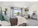 Bright primary suite with vaulted ceiling, chandelier, stylish furnishings and outdoor views at 1302 Milbury St, Castle Rock, CO 80104