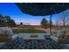 Outdoor patio with comfortable seating and a view of the open backyard at 1302 Milbury St, Castle Rock, CO 80104