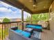 A cozy outdoor space with an outdoor sofa and grill, with a peaceful view of the neighborhood at 30 Sun Up Ct, Erie, CO 80516