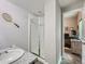 A clean and efficient bathroom with a tiled shower and a granite sink at 30 Sun Up Ct, Erie, CO 80516