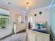 This bedroom features modern lighting and leads to an attached bathroom for convenience at 30 Sun Up Ct, Erie, CO 80516