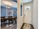 Dining room featuring a large wooden table, stylish chandelier, and lots of natural light at 30 Sun Up Ct, Erie, CO 80516
