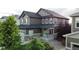 Charming two-story home with a cozy front porch, manicured landscaping, and attractive exterior paint scheme at 30 Sun Up Ct, Erie, CO 80516