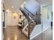 Inviting foyer with a staircase, wood floors, and neutral décor at 30 Sun Up Ct, Erie, CO 80516