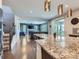 Open kitchen showcasing granite countertops, stainless appliances, and seamless flow to living areas at 30 Sun Up Ct, Erie, CO 80516