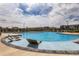 Community pool featuring chaise lounge seating, a play area, and community houses at 30 Sun Up Ct, Erie, CO 80516
